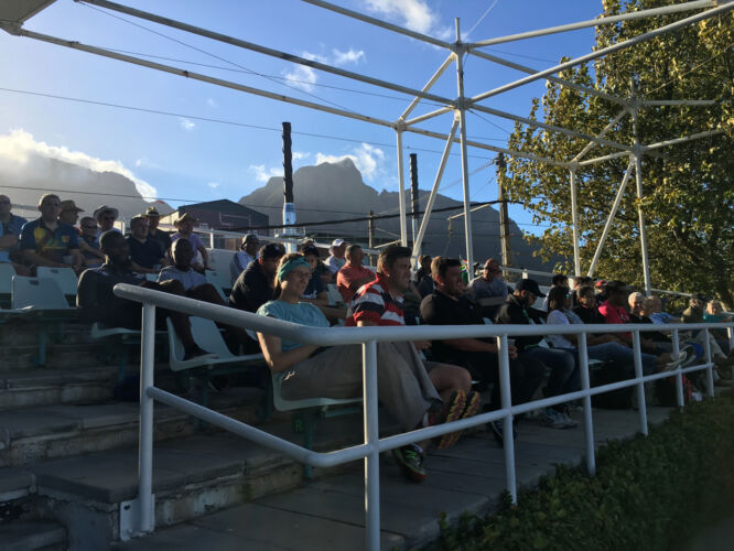 Cricket crowd under the mountain